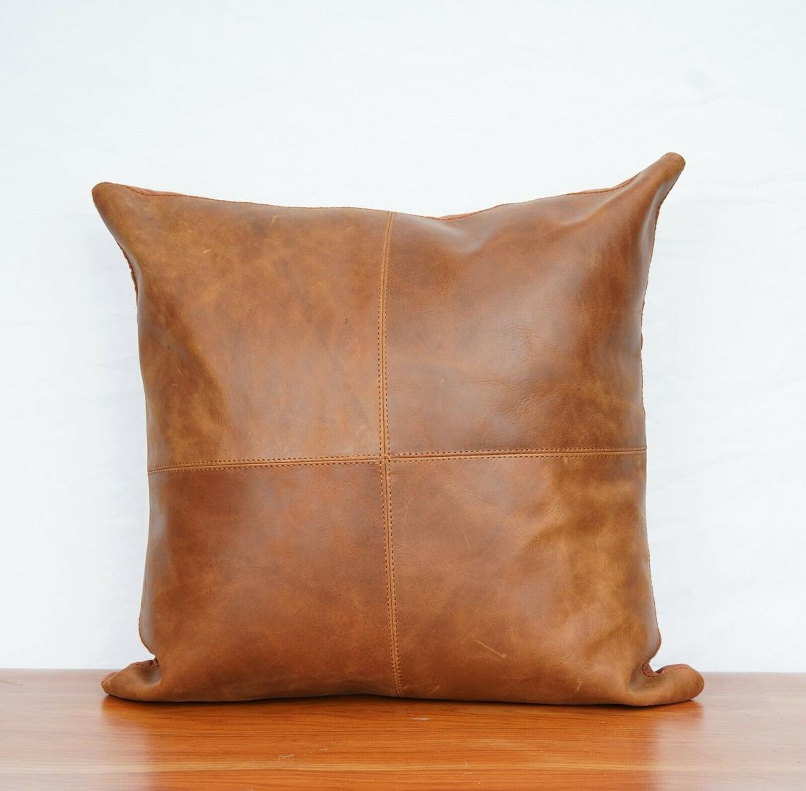 GENUINE LEATHER TAN CUSHION.
