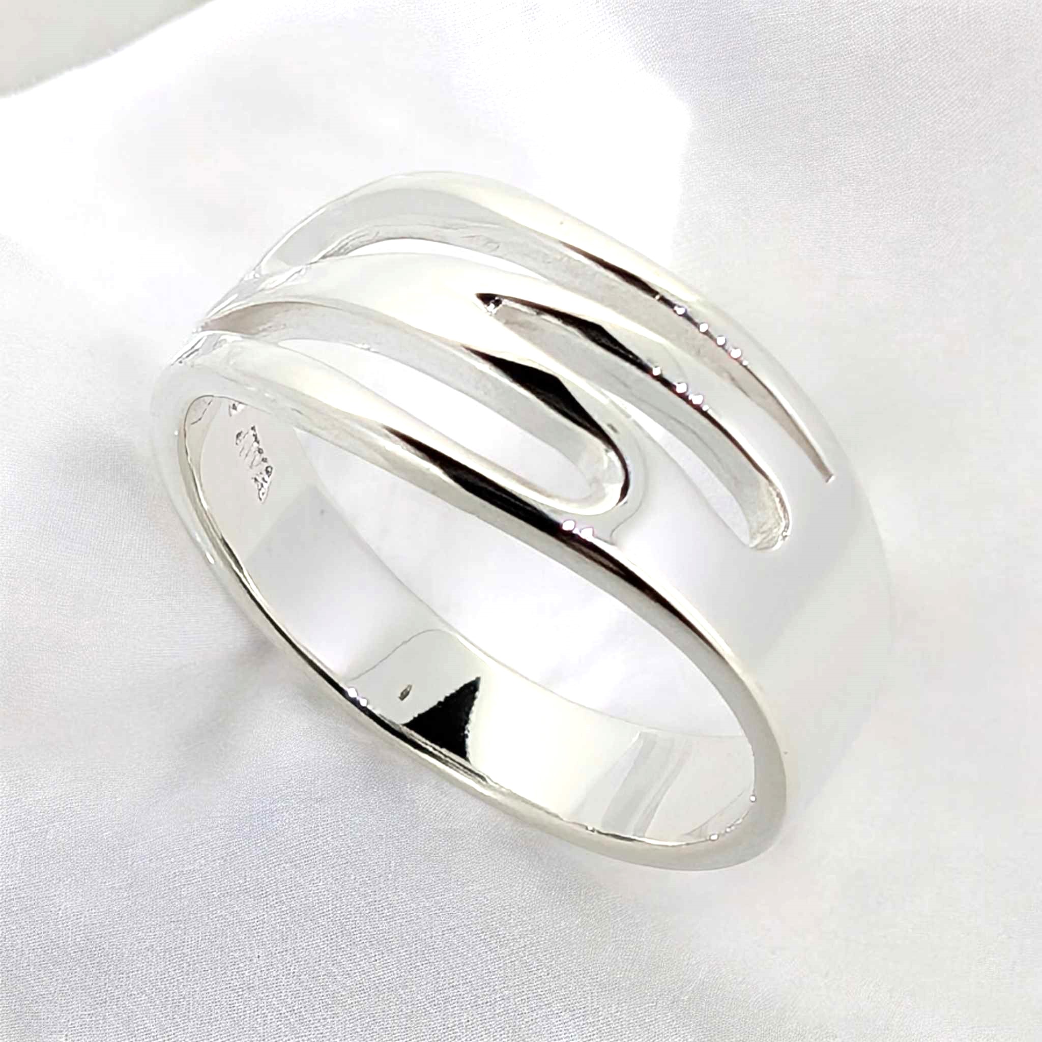 8 The flowing patterns evoke a sense of movement making this sterling silver ring a dynamic and artistic ring that catches the eye