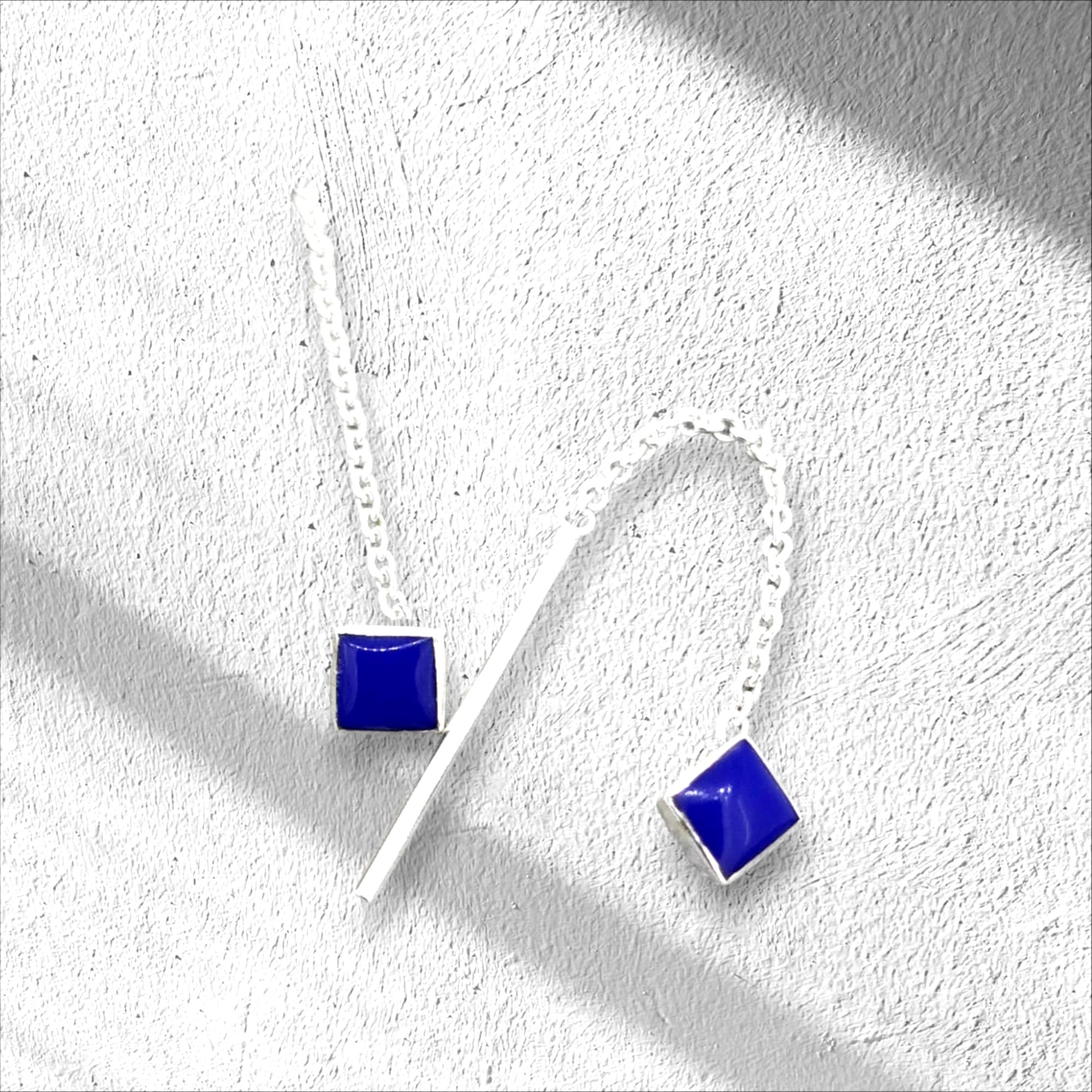 Petite Lapis earrings feature a unique slide-through chain and at the end of each sterling silver chain dangles a thin silver rod