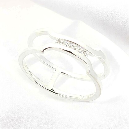 7 A sleek sterling silver band with a delicate cluster of petite white zirconia stones that come together gracefully at the top