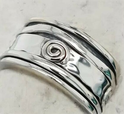 A thicker band with calming spin?feature sterling silver ring