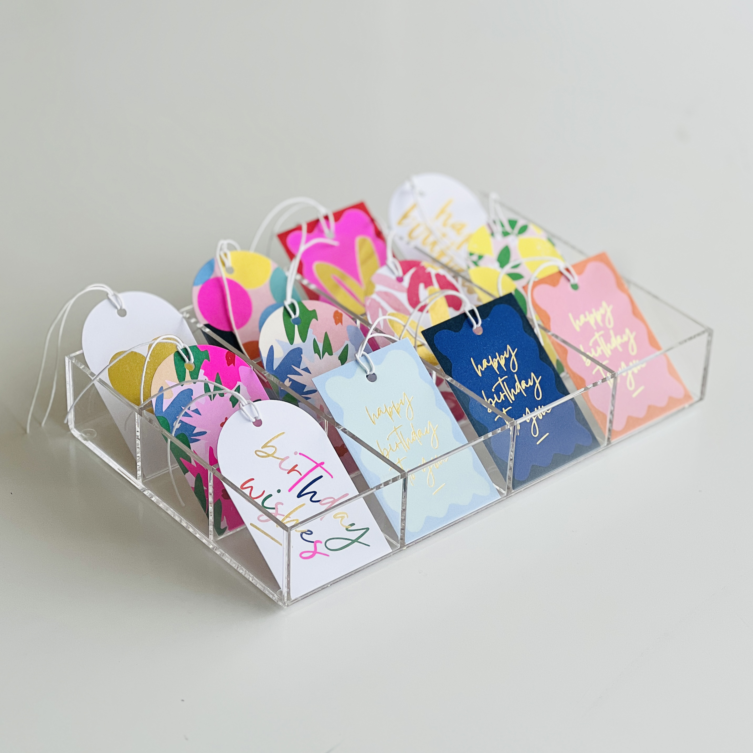 GIFT TAG DISPLAY: $45 or Free $300+ spend across range* (12 gift tag designs are required to be selected)