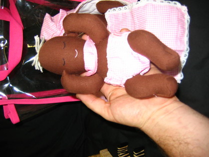 Black Twins in carry cot