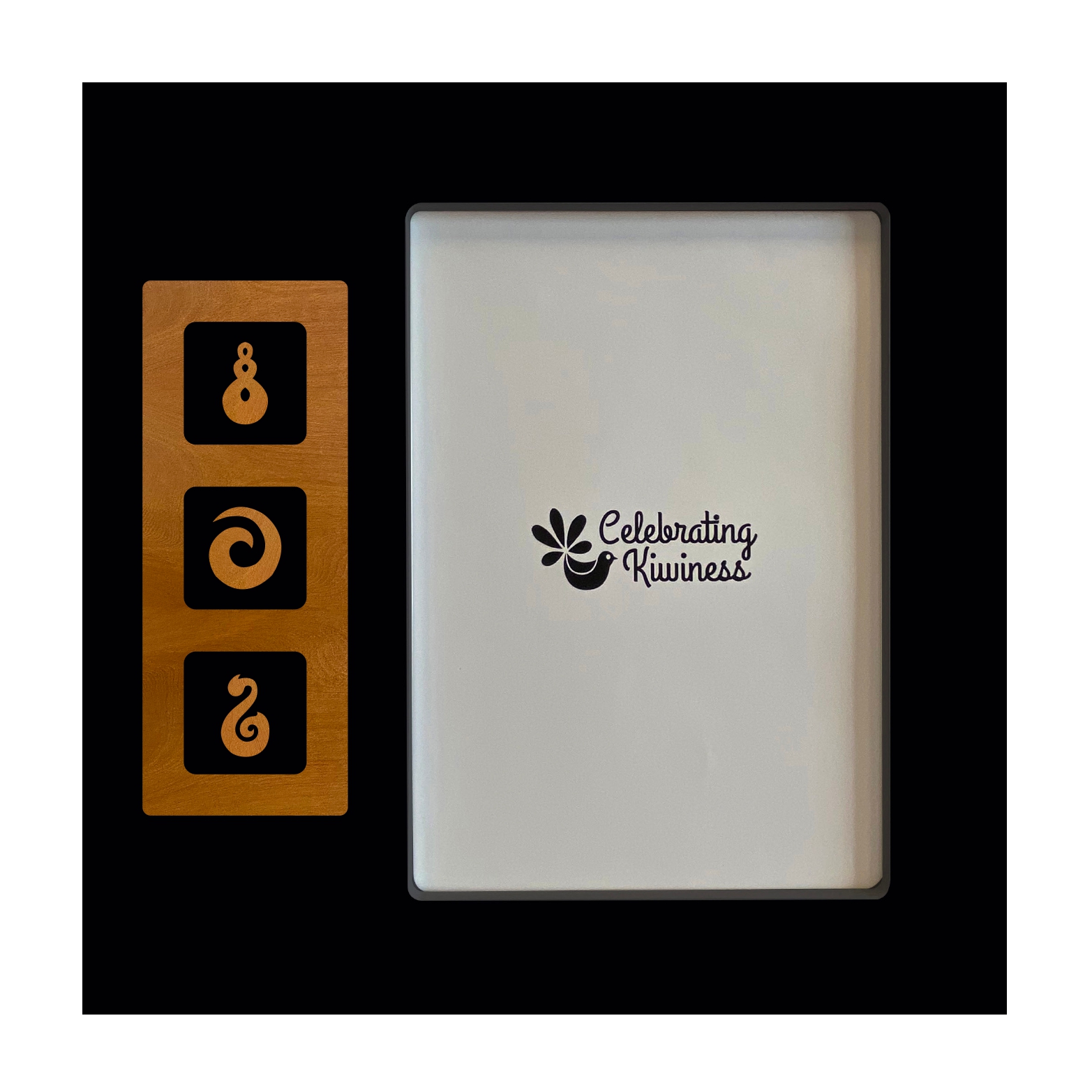 57B3HRR-1 Photo Frame Black 5 x 7 with 3 Hole Rimu Veneer Window and Rimu Veneer Trio: Fish Hook, Koru & Twist